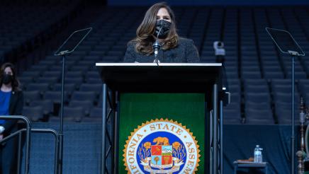 Assemblymember Lisa Calderon standing at the podium