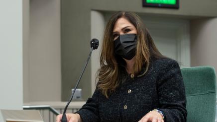 Closeup of Assemblymember Lisa Calderon with a mask on introducing the AB742 - School Supplies for Homeless Children Voluntary Tax Contribution Fund Bill