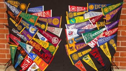 Display with flags from various colleges and universities