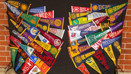 Display with flags from various colleges and universities