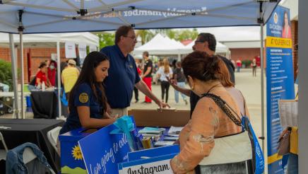 Team Calderon man information booth